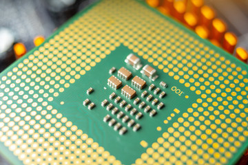 Green electronic chip CPU closeup. Concept of high technology and repair microchip
