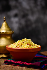 earthenware bowl with tabbouleh on a set table