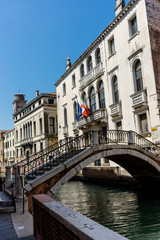 Italy, Venice, a bridge over water with a city in the background