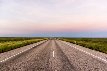 straight road through the outback of Australia, after a beautiful sunset, Nothern territory