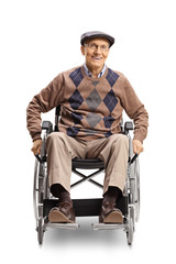 Elderly disabled man in a wheelchair manually pushing the wheels