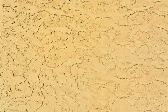 Yellow mortar wall texture. Concrete stacco background