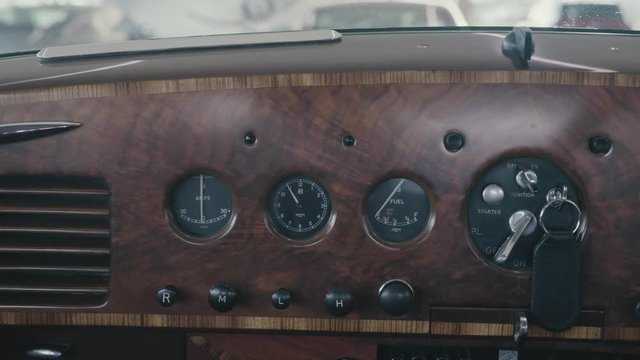 A cinematic view of the Bentley R-type ( R Type ) dials showing the Current the time and the fuel
