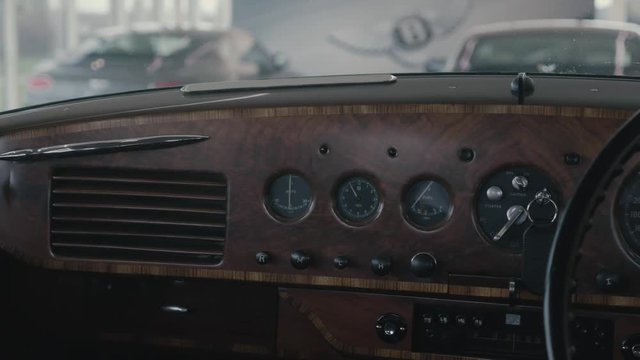A cinematic view of the Bentley R-type ( R Type ) dials showing the Current the time and the fuel