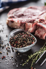 Seasoning four kinds of pepper peas in bowl with raw meat and herbs