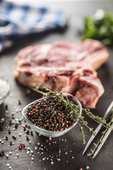 Seasoning four kinds of pepper peas in bowl with raw meat and herbs