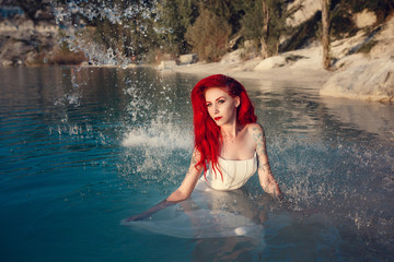 Cosplay on a mermaid Ariel, woman with red hair