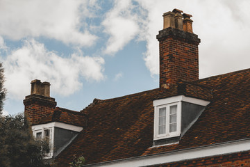 Fototapeta na wymiar Traditional English house chimneys