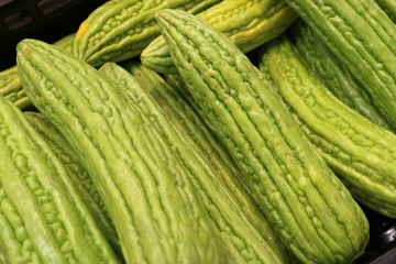 Pile of Bright Green Bitter Cucumbers, Bitter Gourd or Balsam Pear