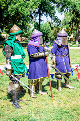 Three medieval soldiers with weapon before the fight_