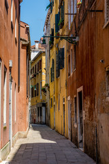 Italy, Venice, a narrow street in front of a brick building