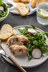 Roasted chicken breasts stuffed with mushrooms, green onion, pepper and garnished fresh salad and rocket salad.