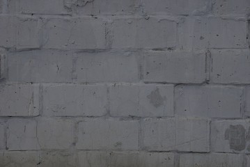gray stone texture of bricks in the wall of the house