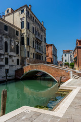 Fototapeta na wymiar Italy, Venice, a bridge leading to a brick building