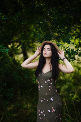 young girl standing by the leaves