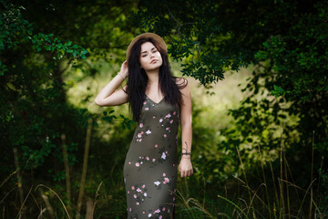 young girl standing by the leaves