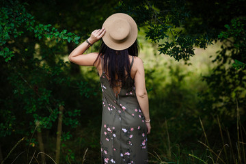 young girl standing by the leaves