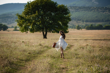 Smiling cheerful girl breathes a full breast and enjoys freedom