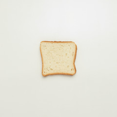 Slice of toast on a white background.