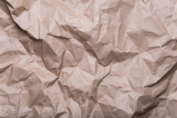 Obraz premium crumpled cream craft paper background texture