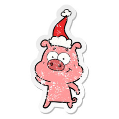 happy distressed sticker cartoon of a pig wearing santa hat