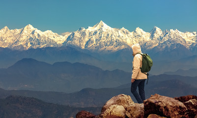 Male tourist hiker admire the majestic Kumaon Himalaya mountain range at Munsiyari Uttarakhand India. - obrazy, fototapety, plakaty