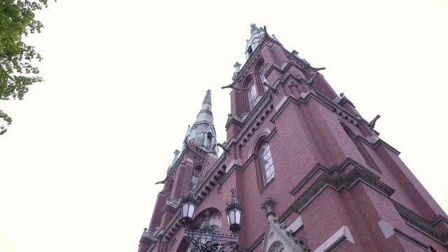 Static shot up towards the top of St Johns Church, on a overcast, summer day, in Ullanlinna, Helsinki, Finland