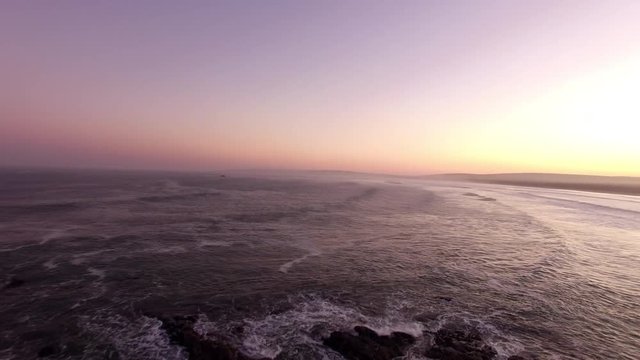 Drone shot over ocean.