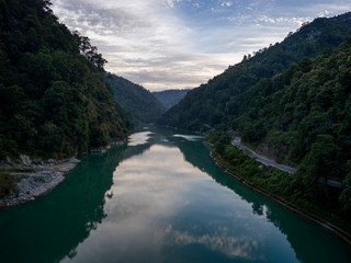 Reflection of clouds in Teesta River, Mangber Forest, Sikkim, India