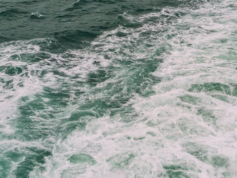 Close-up view of churning white wake, from the back of a boat crossing the English Channel.