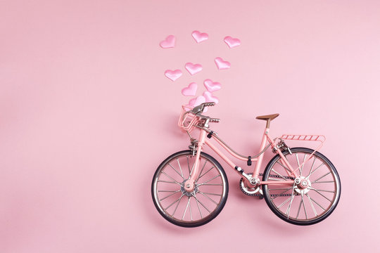 Pink bicycle on pink background. pastel minimal style concept. Top view