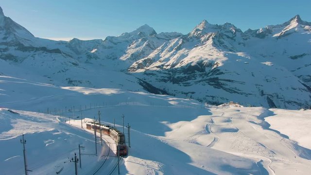 Matterhorn Mountain and Gornergrat Train in Winter at Sunset. Swiss Alps. Switzerland. Aerial View