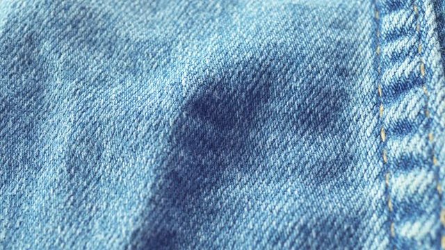 Blue pants. Flight of the camera above the surface of the fabric
