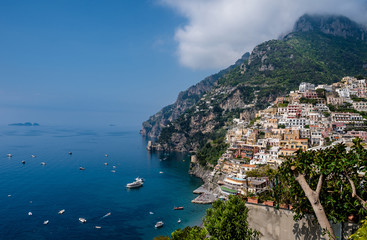 Panoramic view of beach and colorful buildings  in Positano town  at  Amalfi Coast, Italy.