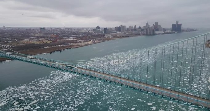 Ice floating along the Detroit-Windsor border with the city skyline in the background.