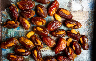 Fresh dates with almonds on a table