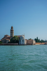 Italy, Venice, San Michele in Isola, BUILDINGS AT WATERFRONT AGAINST CLEAR SKY Murano
