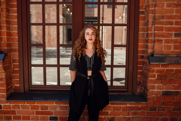 Young and fashionable overweight woman walking around town