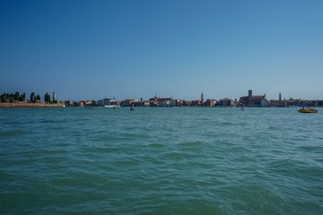 Fototapeta premium Italy, Venice, a boat on a body of water