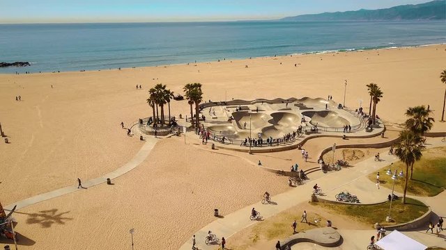 Drone footage over the bike path and skate park in Venice beach California