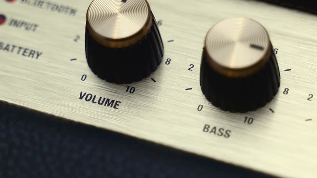 B-roll of a Marshall guitar amplifier, bluetooth sound box .