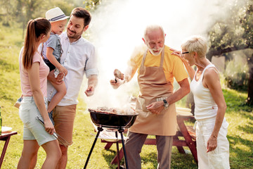 Family having a barbecue in the garden