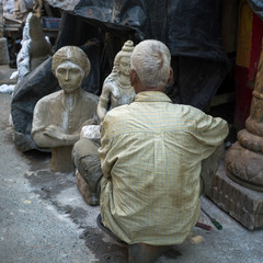 Artist working on an idol of Lord Shiva, a Hindu God, Kumartuli, Kolkata, West Bengal, India