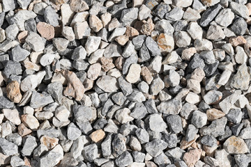 Small gray-white stones background. Natural environmental material