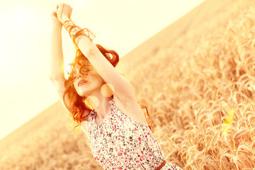 red hair beauty in sommer sunset