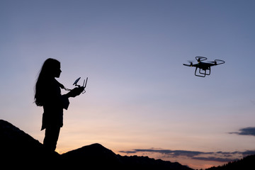 Fototapeta na wymiar female drone user and trained person
