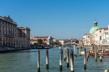 Italy, Venice, Grand Canal, a boat is docked next to a body of water with Grand Canal in the background