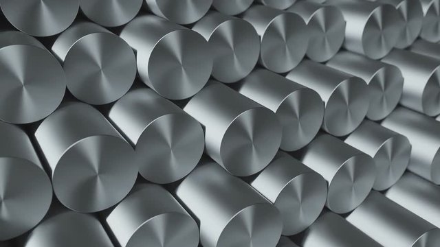 Close-up set of metal round kernels and bars. Industrial metallic background. Loop 3d animation
