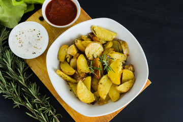 Spicy fried potatoes with a golden crust. Vegetarian dinner or lunch.