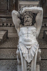 Statue of powerful and emotional atlas of Renaissance Era in Vienna, Austria, details, closeup